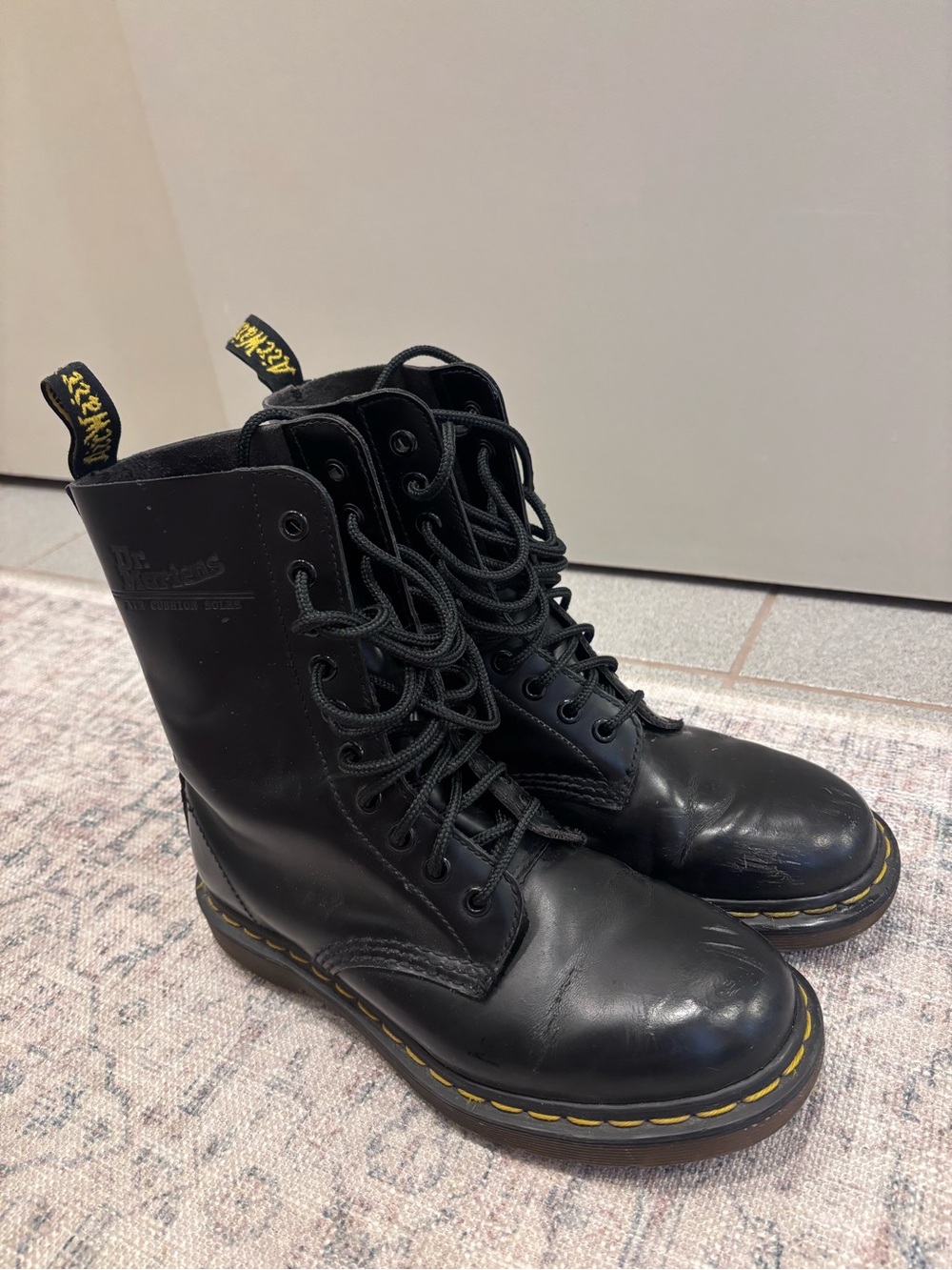 Dr. Martens Black 10-Eye Leather Lace-Up Boots with Yellow Stitching